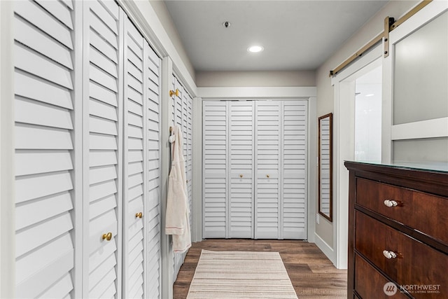 2336 Grand Ave, East Wenatchee, WA 98802 - hallway with recessed lighting, a barn door, and dark wood-style floors