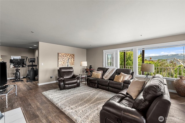 2336 Grand Ave, East Wenatchee, WA 98802 - living area with dark wood-type flooring, healthy amount of natural light, and baseboards