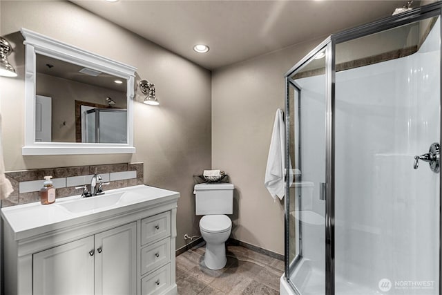 2336 Grand Ave, East Wenatchee, WA 98802 - full bathroom featuring vanity, a stall shower, toilet, baseboards, and recessed lighting