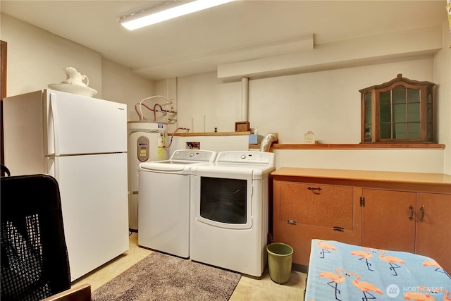 32030 83rd Dr NW, Stanwood, WA 98292 - laundry room with cabinet space, separate washer and dryer, and electric water heater