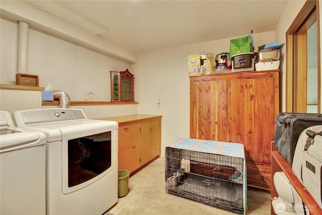 32030 83rd Dr NW, Stanwood, WA 98292 - washroom featuring washer and clothes dryer, light carpet, and cabinet space