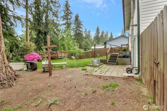 32030 83rd Dr NW, Stanwood, WA 98292 - view of yard featuring fence, a deck, and a patio area
