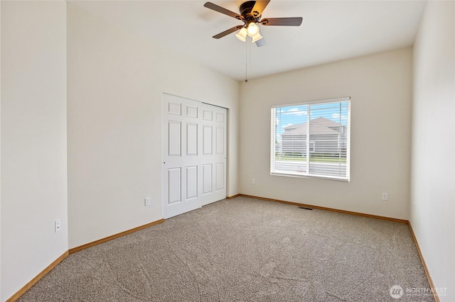 121 Scenic Dr NE, Moses Lake, WA 98837 - unfurnished bedroom with carpet flooring, baseboards, and a ceiling fan