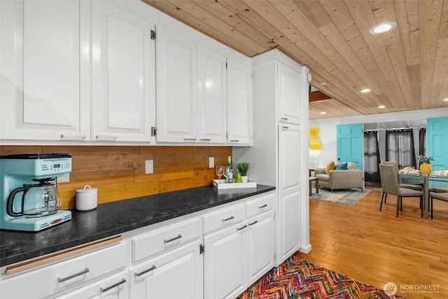 1900 N Westlake Ave N Unit 01Do7, Seattle, WA 98109 - kitchen with wood ceiling, white cabinetry, light wood-type flooring, recessed lighting, and open floor plan