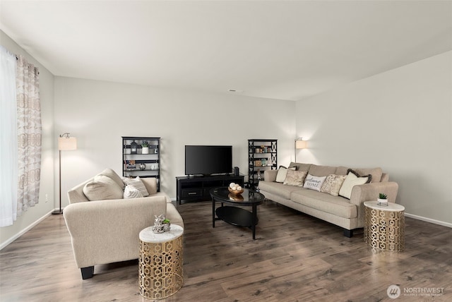 living room with wood finished floors and baseboards