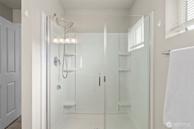 full bath featuring a stall shower and healthy amount of natural light