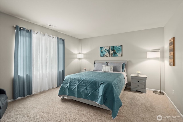 carpeted bedroom with baseboards