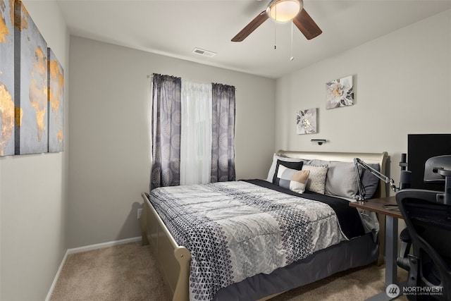 bedroom with carpet flooring, baseboards, ceiling fan, and a desk