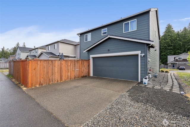 view of side of property with driveway