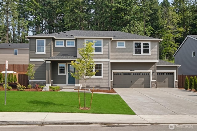 9825 38th Street Ct E Unit 38, Edgewood, WA 98371 - view of front facade featuring concrete driveway, a garage, and stone siding