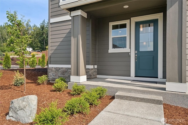 9825 38th Street Ct E Unit 38, Edgewood, WA 98371 - doorway to property with stone siding and covered porch