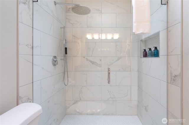 full bath with a shower stall and toilet