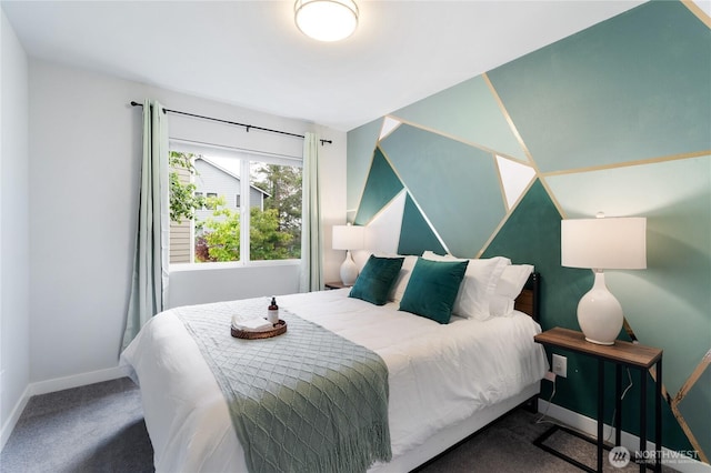 bedroom featuring carpet floors and baseboards