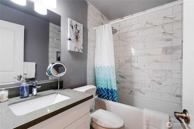 full bathroom featuring shower / bath combo with shower curtain, toilet, and vanity