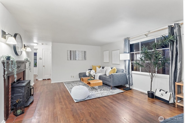 2607 NE 137th St, Seattle, WA 98125 - living area featuring wood finished floors, baseboards, and a wood stove