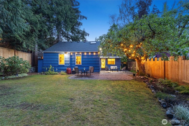 2607 NE 137th St, Seattle, WA 98125 - back of property at dusk with a patio