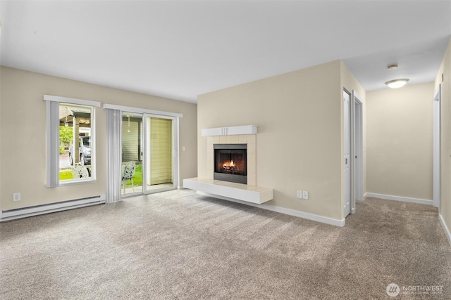 12303 Harbour Pointe Blvd Unit U109, Mukilteo, WA 98275 - unfurnished living room featuring baseboard heating, carpet floors, a fireplace, and baseboards