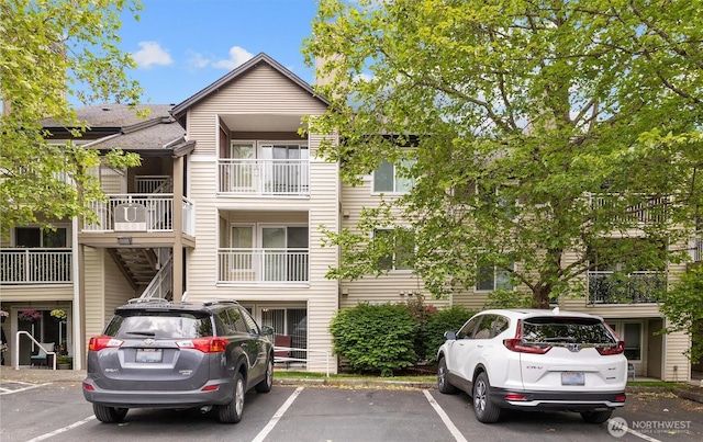 12303 Harbour Pointe Blvd Unit U109, Mukilteo, WA 98275 - view of building exterior with uncovered parking