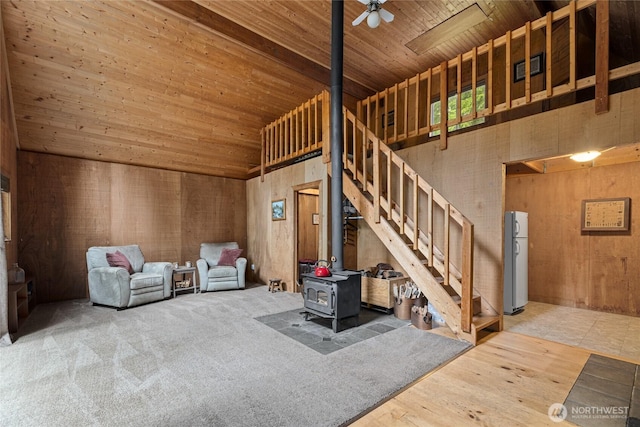 4771 Kachess Lake Rd, Easton, WA 98925 - living room with high vaulted ceiling, a wood stove, wood ceiling, stairs, and a ceiling fan