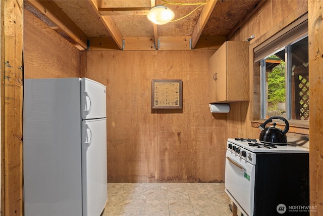 4771 Kachess Lake Rd, Easton, WA 98925 - kitchen featuring white appliances and wooden walls