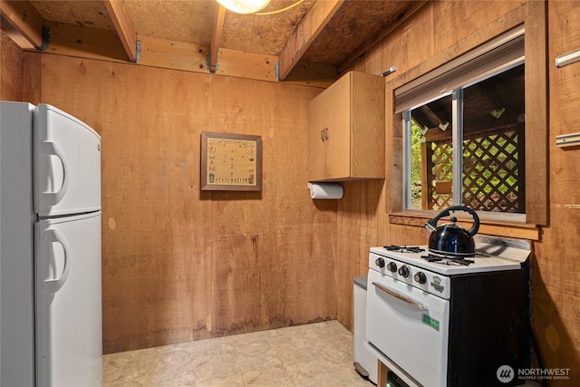 4771 Kachess Lake Rd, Easton, WA 98925 - kitchen with white appliances and wood walls