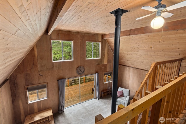 4771 Kachess Lake Rd, Easton, WA 98925 - stairs featuring wooden walls, wooden ceiling, lofted ceiling, carpet, and ceiling fan