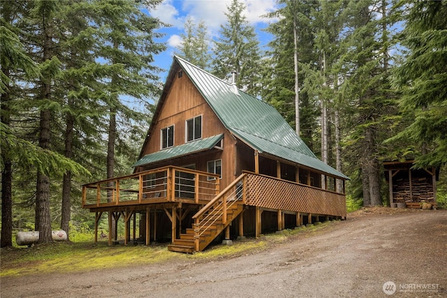 4771 Kachess Lake Rd, Easton, WA 98925 - view of front of house featuring metal roof, a wooden deck, and stairway