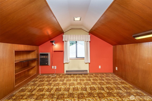 bonus room with a baseboard heating unit, lofted ceiling, wooden walls, a wall mounted AC, and carpet flooring