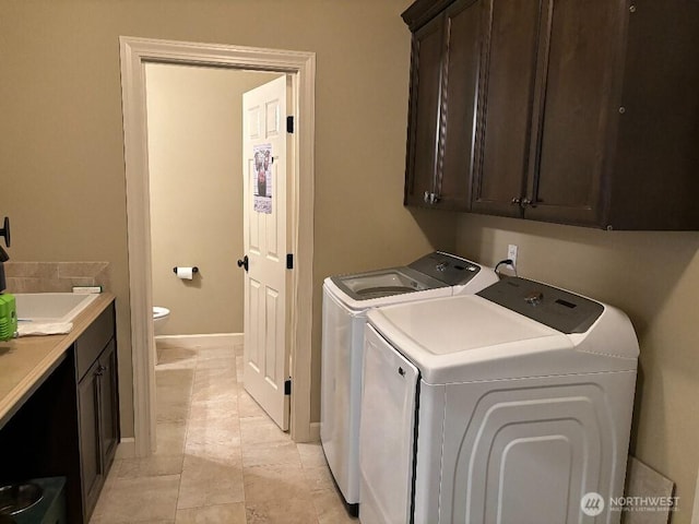 2702 N Levi St, Kennewick, WA 99338 - laundry room featuring cabinet space, washer and dryer, and baseboards