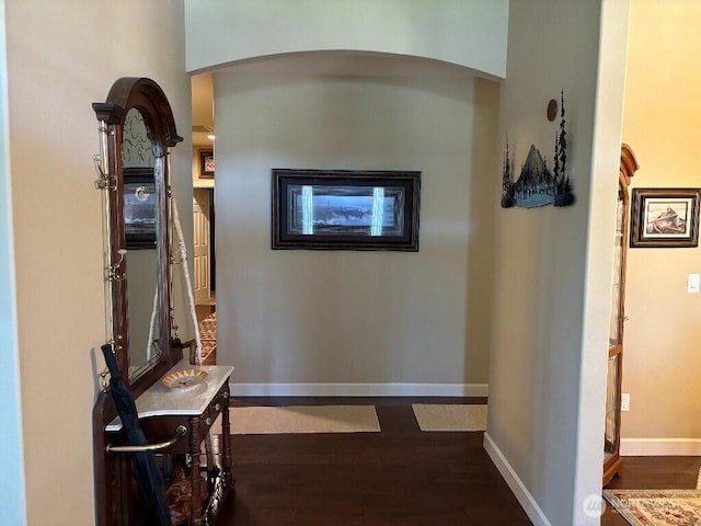 2702 N Levi St, Kennewick, WA 99338 - hall with dark wood-style floors, arched walkways, and baseboards