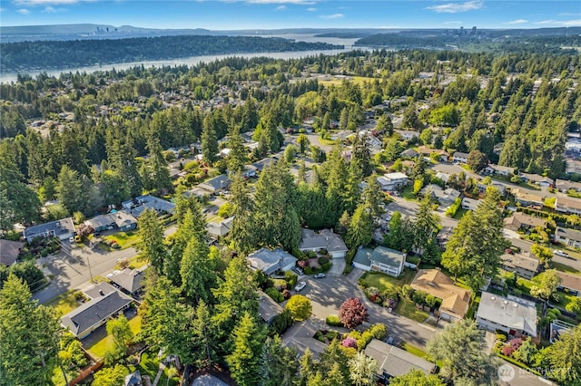 12211 SE 65th Pl, Bellevue, WA 98006 - aerial view of property's location with nearby suburban area, a forest, and mountains