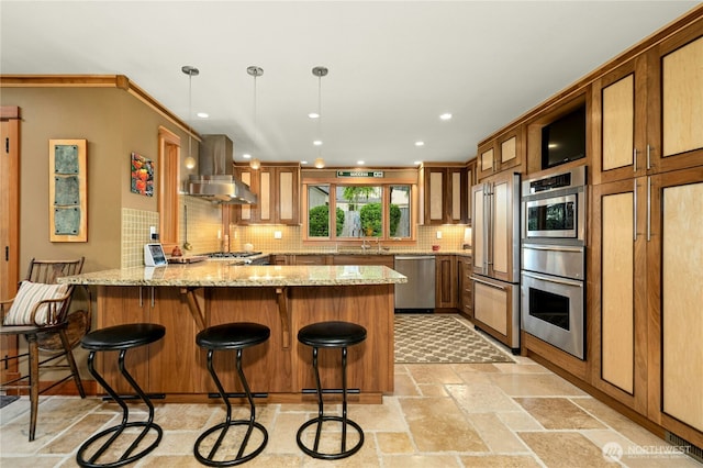 12211 SE 65th Pl, Bellevue, WA 98006 - kitchen with appliances with stainless steel finishes, island range hood, a peninsula, a sink, and tasteful backsplash