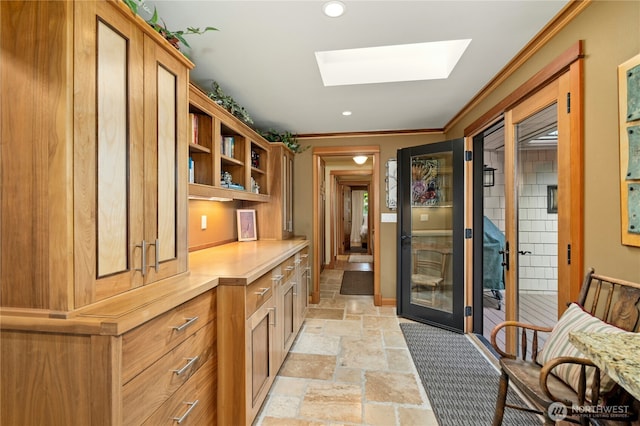12211 SE 65th Pl, Bellevue, WA 98006 - home office with stone tile flooring, ornamental molding, a skylight, and recessed lighting