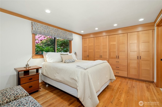 12211 SE 65th Pl, Bellevue, WA 98006 - bedroom with light wood finished floors and recessed lighting