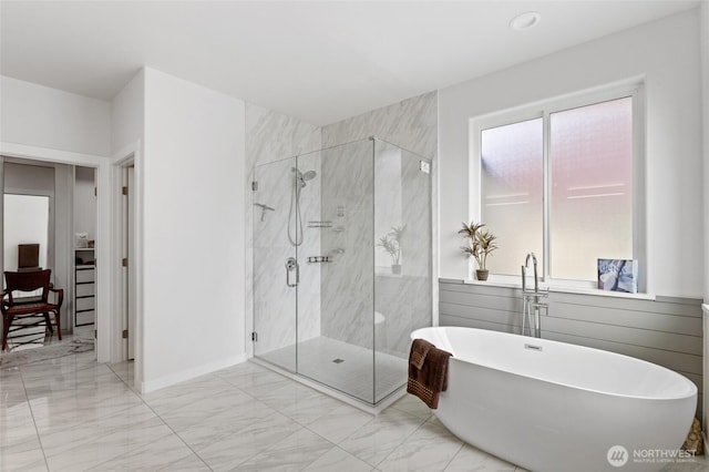 227 N Crestview Dr, Moses Lake, WA 98837 - full bathroom with marble finish flooring, a freestanding bath, a stall shower, and baseboards