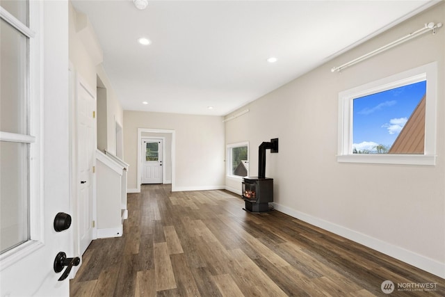 511 S 2nd St, Roslyn, WA 98941 - entrance foyer featuring a wood stove, dark wood-style flooring, recessed lighting, and baseboards