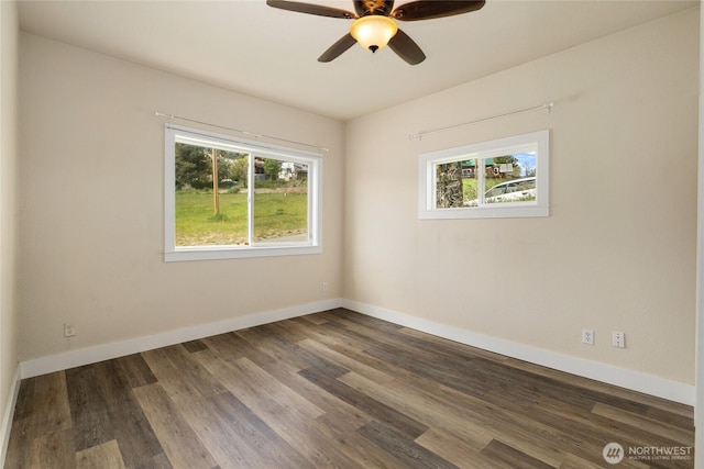 511 S 2nd St, Roslyn, WA 98941 - spare room with plenty of natural light, ceiling fan, and dark wood-style floors