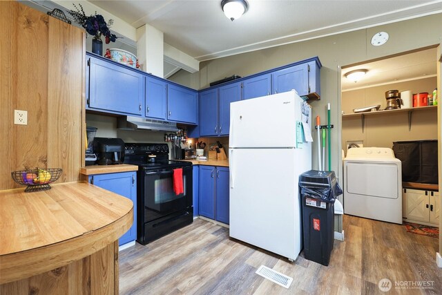 208 S Monroe St, Aberdeen, WA 98520 - kitchen with freestanding refrigerator, black electric range oven, washer / dryer, and blue cabinetry