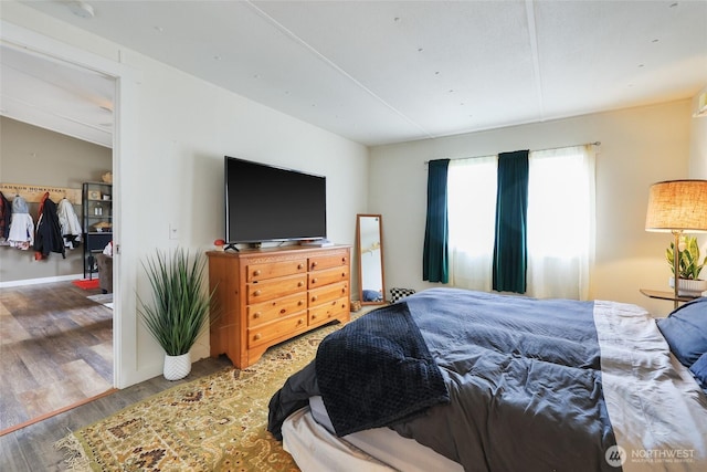 208 S Monroe St, Aberdeen, WA 98520 - bedroom featuring wood finished floors and baseboards