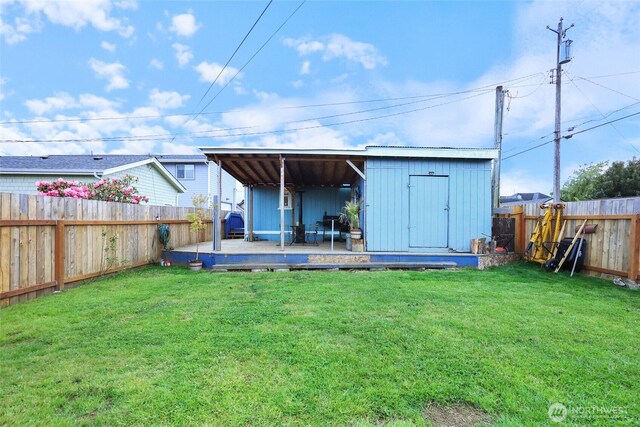 208 S Monroe St, Aberdeen, WA 98520 - back of house featuring a deck, board and batten siding, and an outdoor structure