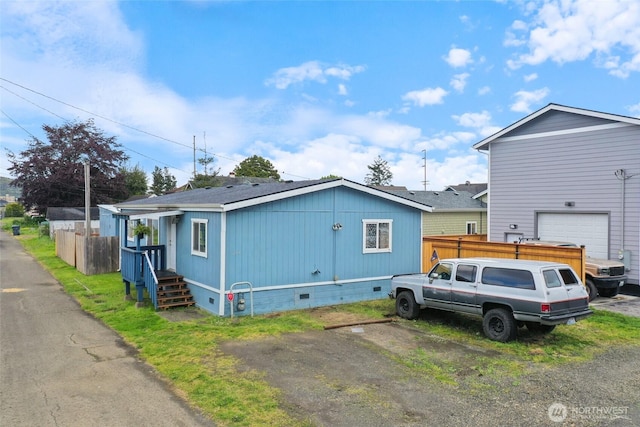 208 S Monroe St, Aberdeen, WA 98520 - view of front facade featuring crawl space, roof with shingles, and an attached garage
