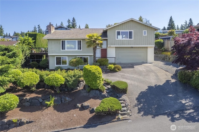 245 SW 298th Pl, Federal Way, WA 98023 - view of front of house featuring an attached garage, concrete driveway, and a chimney