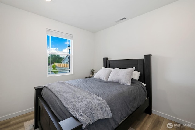 12605 179th St E, Puyallup, WA 98374 - bedroom featuring baseboards and wood finished floors