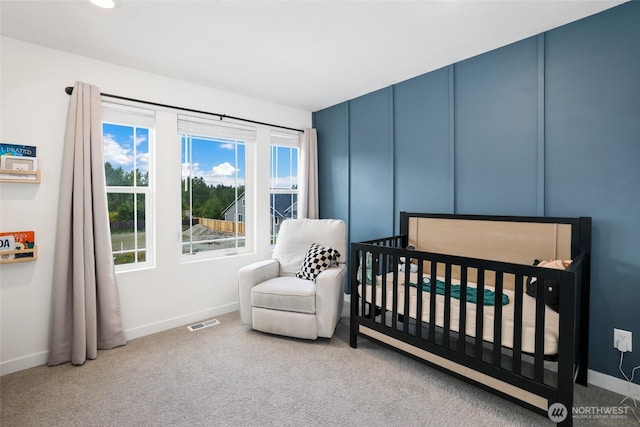 12605 179th St E, Puyallup, WA 98374 - carpeted bedroom featuring baseboards and a nursery area
