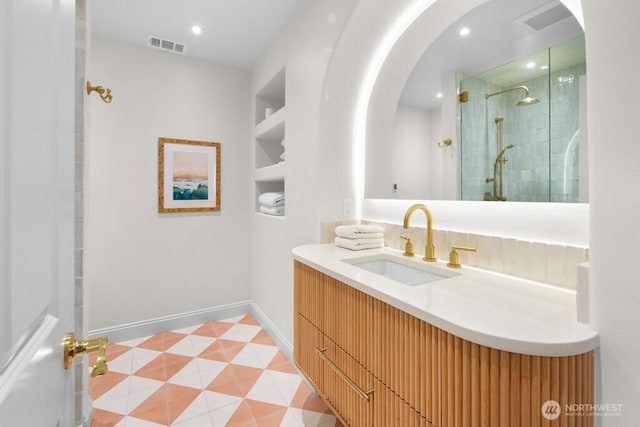 3727 W Barrett St, Seattle, WA 98199 - bathroom with a shower stall, vanity, baseboards, and built in shelves