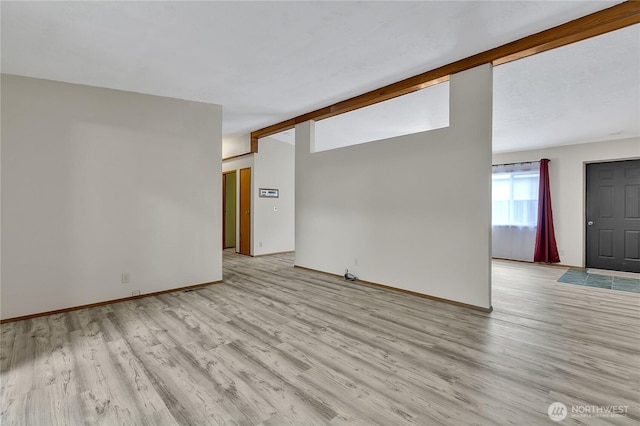 11120 SE 234th Pl, Kent, WA 98031 - empty room with light wood-style floors and baseboards