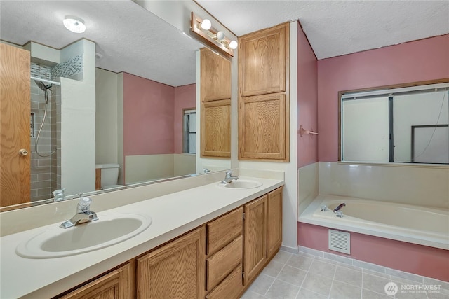 11120 SE 234th Pl, Kent, WA 98031 - full bathroom with a textured ceiling, a bath, tile patterned floors, double vanity, and a shower