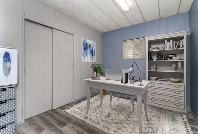 home office with wood finished floors