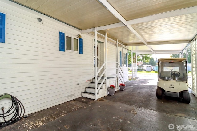 view of patio with entry steps and a carport