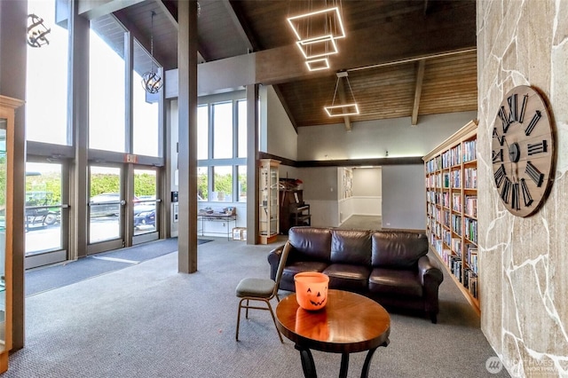 living room with high vaulted ceiling, wooden ceiling, carpet floors, and beam ceiling